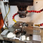 EDM burning Buttress thread detail onto mold slides.